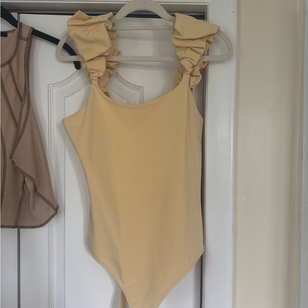 Yellow ruffled bodysuit